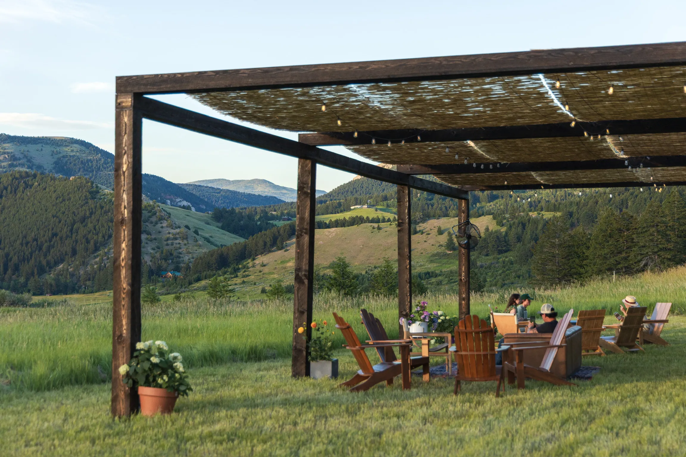 Open-air timber pavilion on the high meadow.