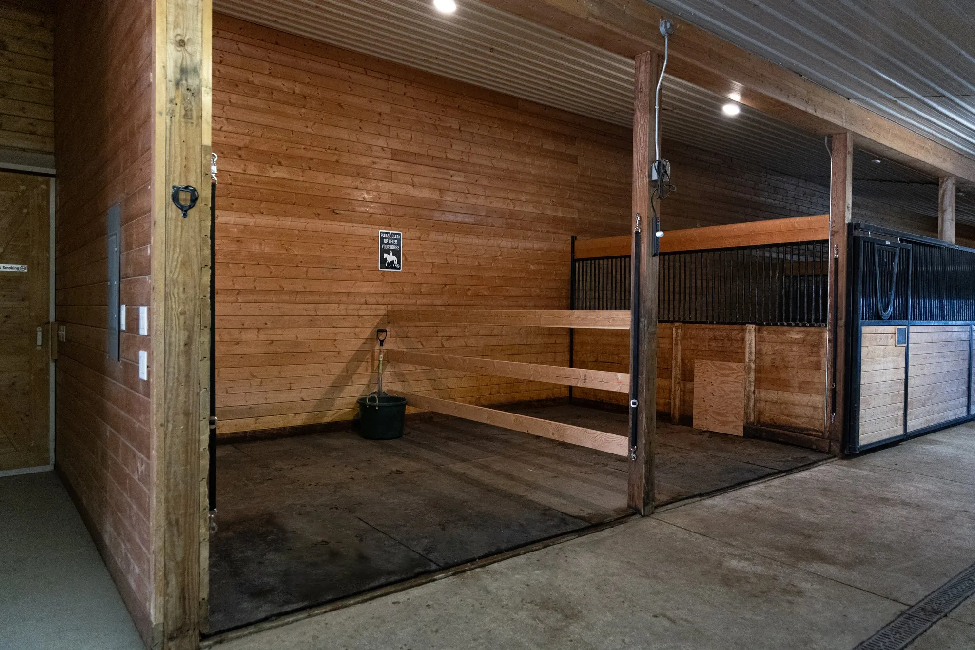 Inside the barn, stalls down the aisle
