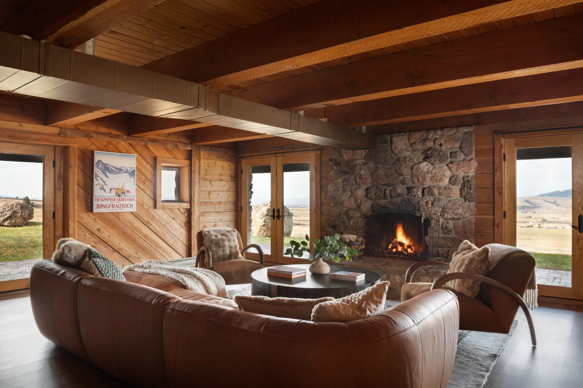 Seating area around the stone fireplace on the lower level