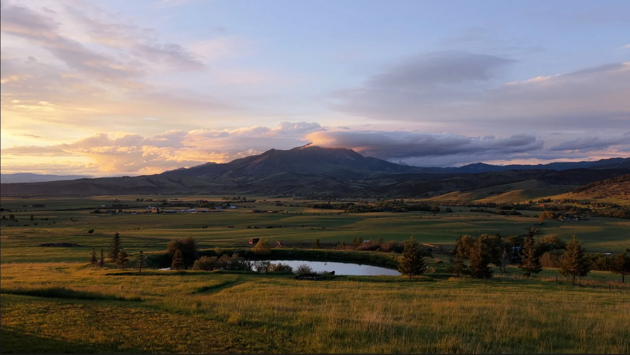 Down valley views of the ranch and the Bridgers at sunset