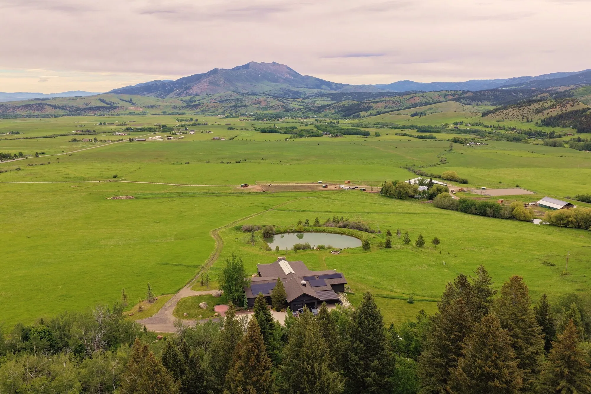 Birdeye view of the ranch with Bridger mountain in the backdrop