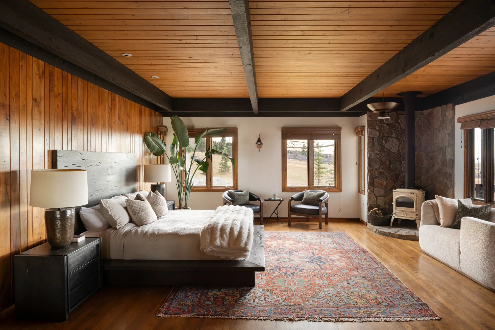 Master Suite: vaulted wood-wall bedroom